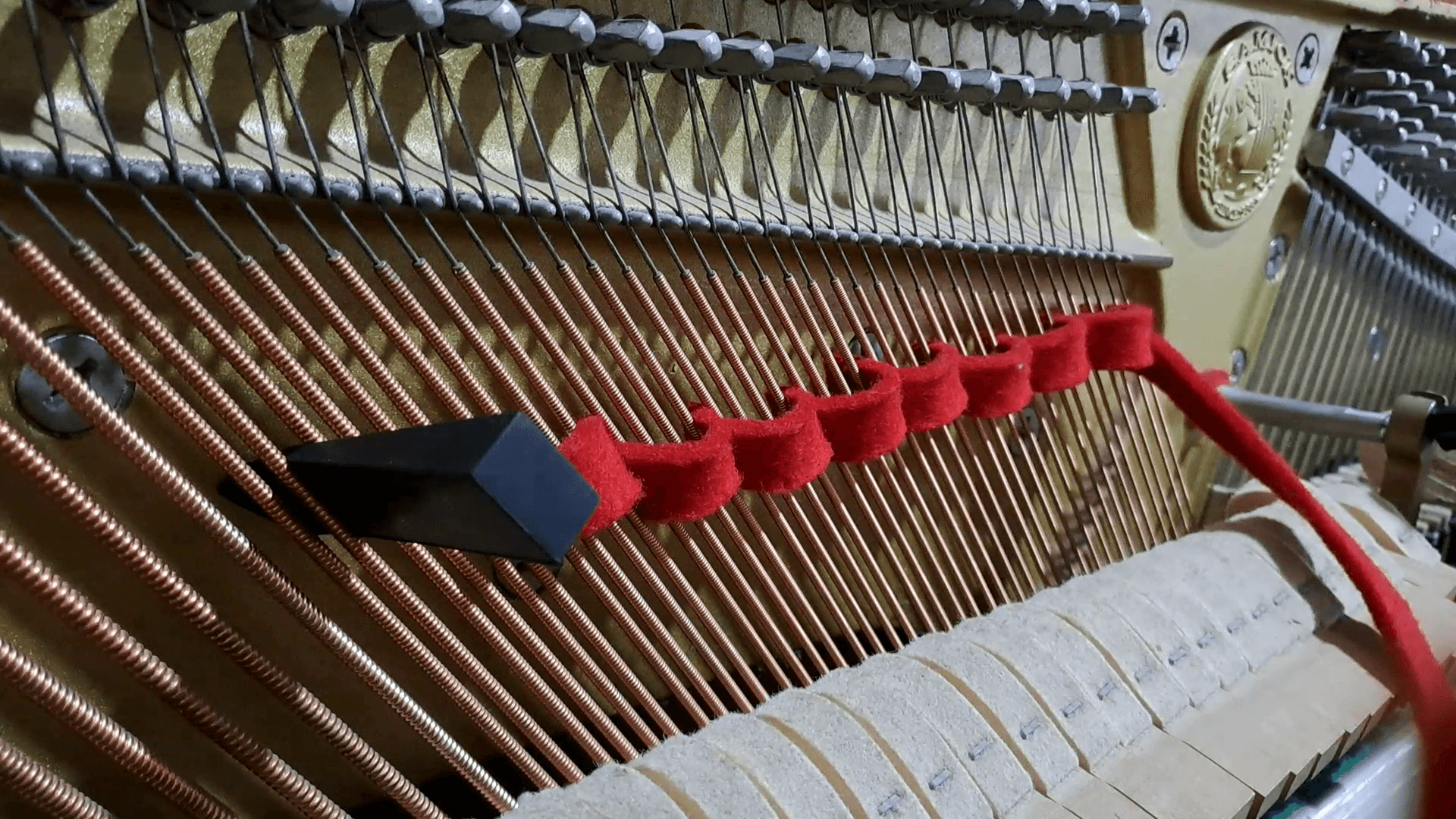 Bass strings, bridge and felt damper mute